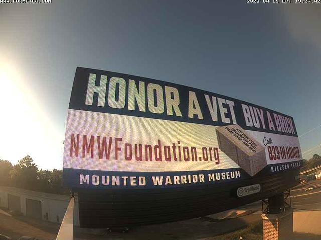 A large billboard with the words honor a vet on it