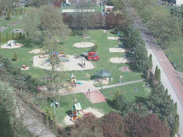 An aerial view of a park with children playing in it