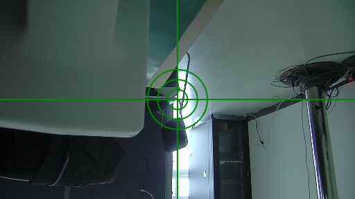 A view of a room through a green laser