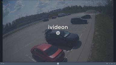 A screen shot of a highway with cars driving on it