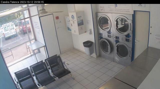 A picture of a bathroom with a washer and dryer