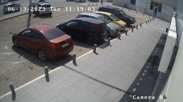 A group of cars parked in a parking lot