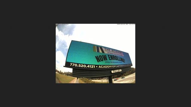 A billboard with the words now available on it