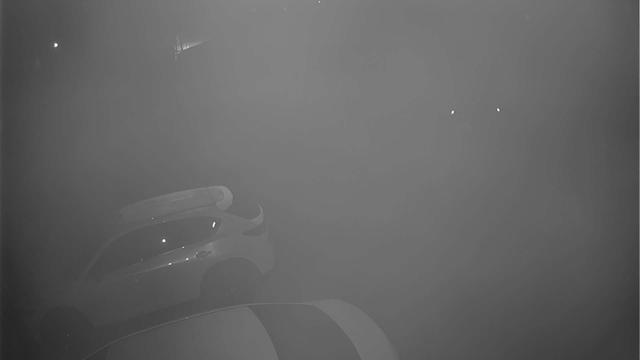 A black and white photo of a foggy sky