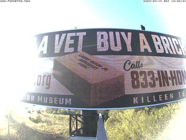 A billboard with a box on it that says a vet buy a brick