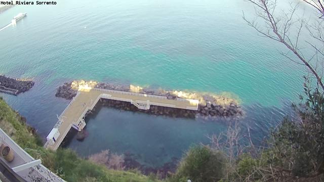 An aerial view of a pier in the water