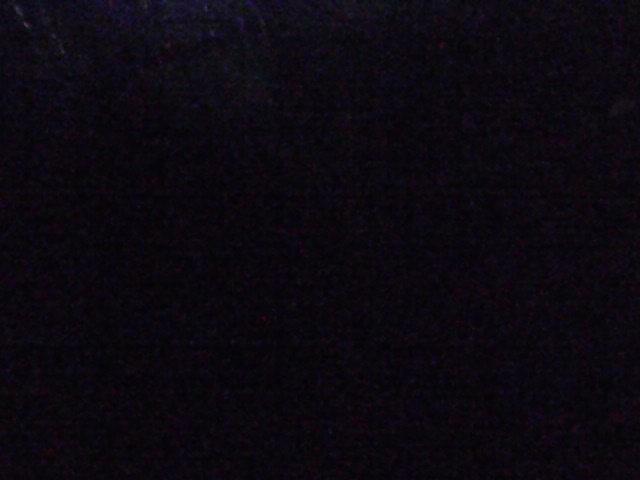 A blurry image of a dark night sky