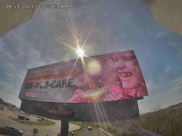 A large billboard with a woman's face on it
