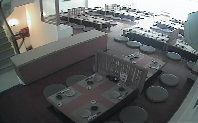 A panoramic view of a restaurant with tables and chairs