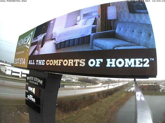 A billboard with a picture of a couch on it