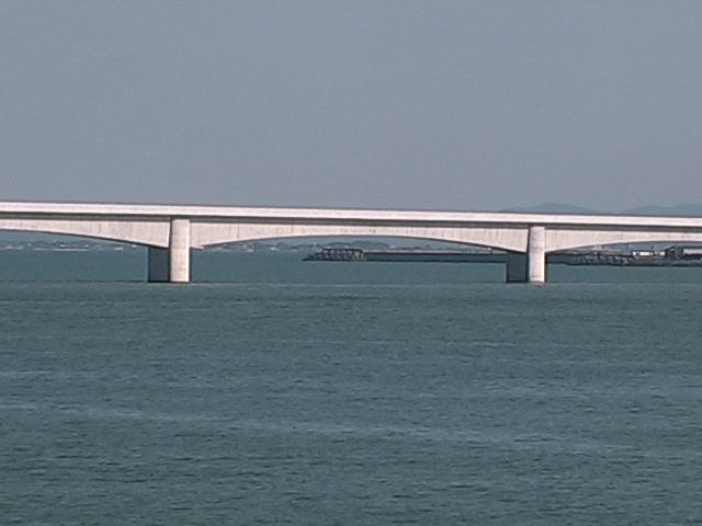 A large bridge over a large body of water