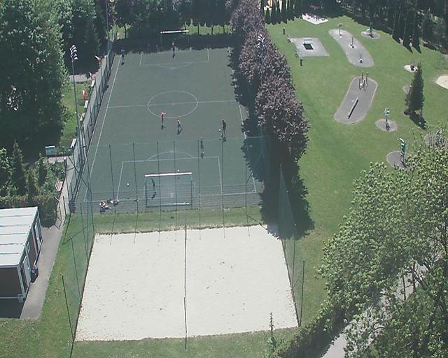 An aerial view of a soccer field and a basketball court