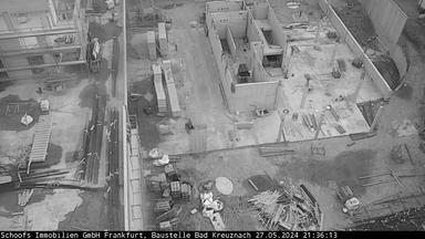 A black and white photo of an aerial view of a construction site