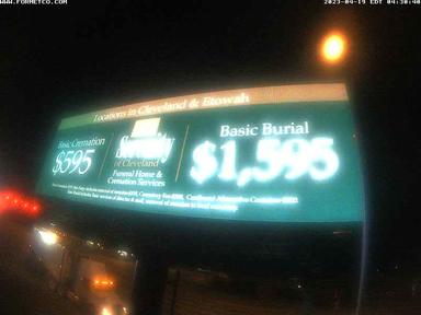 A billboard is lit up in the dark