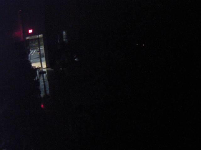 A blurry photo of a red light in the dark