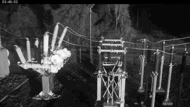 A black and white photo of a power line