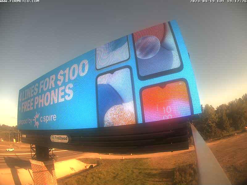 A billboard advertising a cell phone store