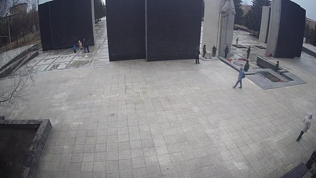 A skateboarder is doing a trick on a ramp