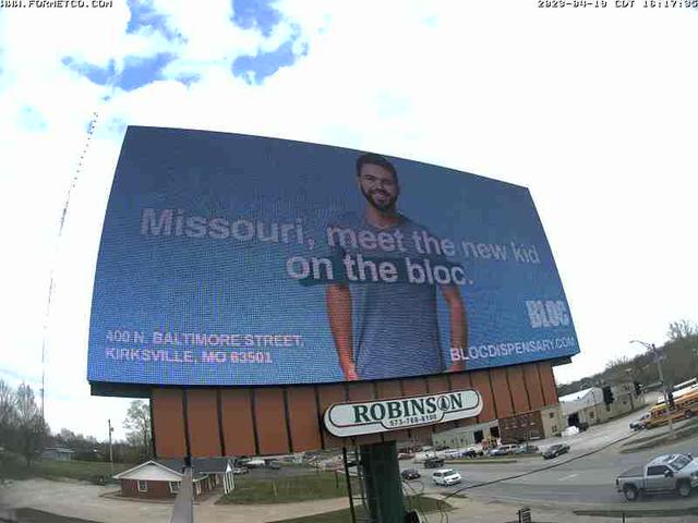 A billboard with a picture of a man on it