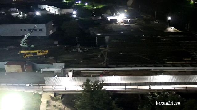 An aerial view of a train station at night