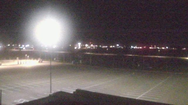 A blurry photo of a tennis court at night