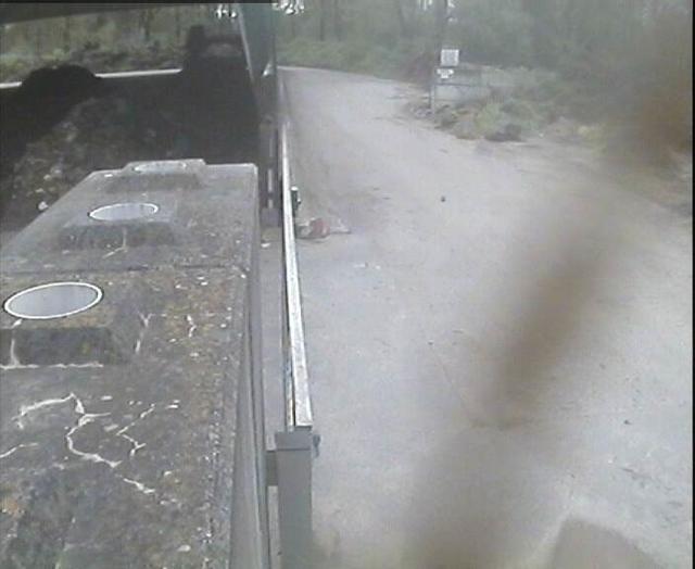 A blurry image of a truck driving down a road
