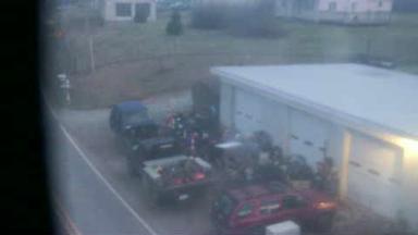 A blurry photo of a truck and other vehicles