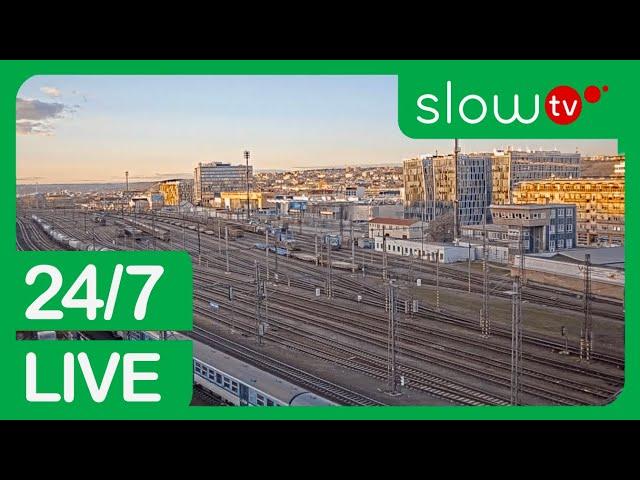A picture of a train station with the words slow tv 24 / 7 live