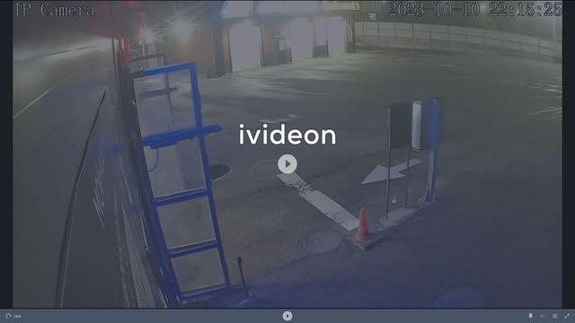 A screen shot of a parking lot with a video on it