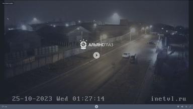 A webcam image of a street at night
