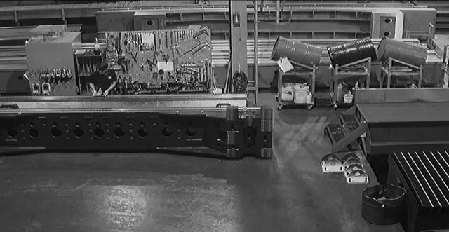 A black and white photo of machinery in a factory