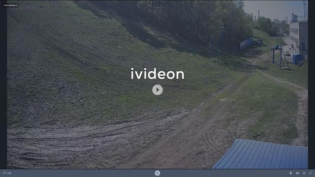 A screen shot of a video of a dirt road