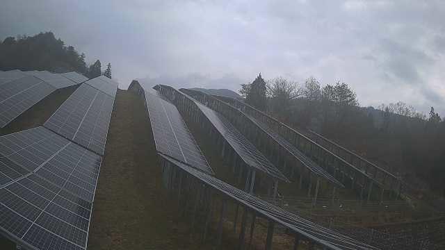A photo of a solar power plant on a cloudy day