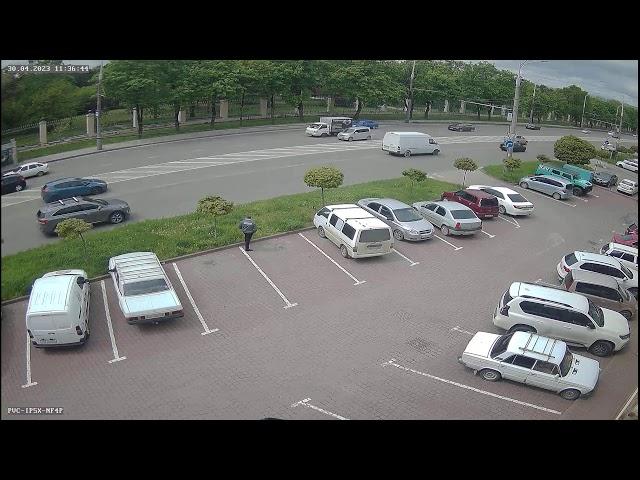 A parking lot filled with lots of parked cars