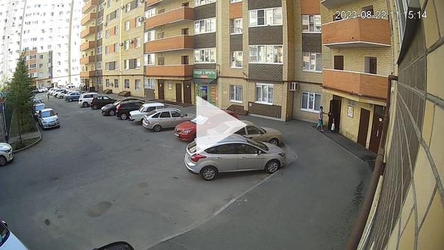 A view of a parking lot with cars parked in it