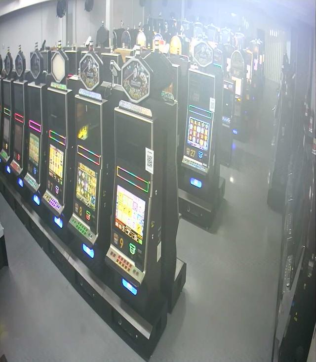 A row of slot machines sitting next to each other