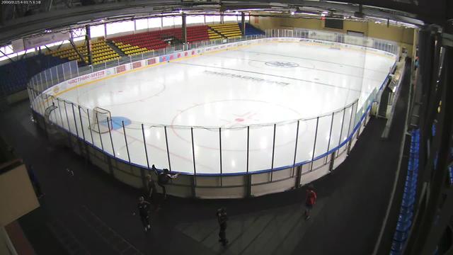 A hockey rink with a fence around it