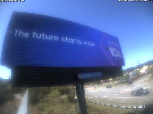 A blue sign that says the future starts now