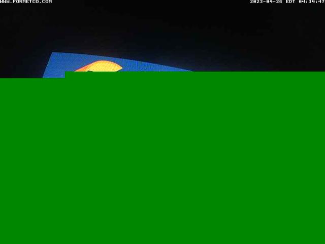 A green screen with a yellow sun in the background