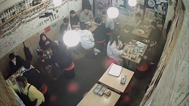 A fish eye view of a restaurant with tables and chairs