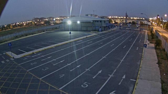 A picture of a parking lot at night