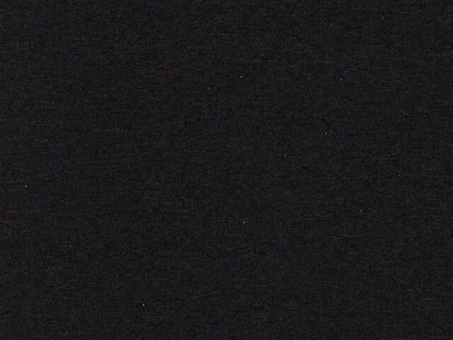 A black background with a small white dot in the middle