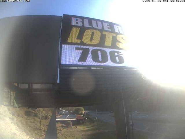 A billboard with a bluer lot's 706 advertisement on it