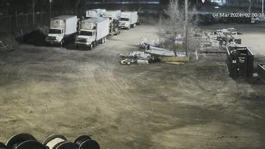 A group of trucks parked next to each other in a parking lot