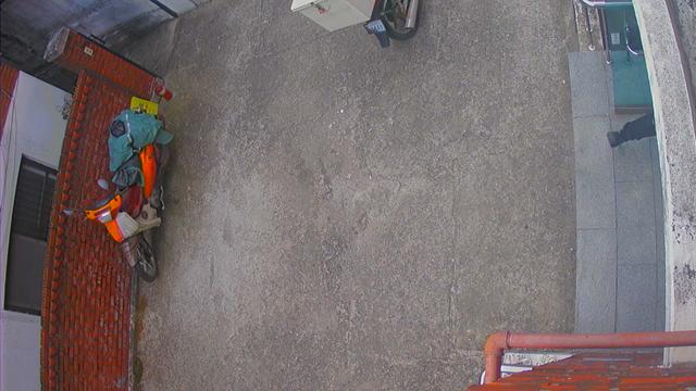 An aerial view of a construction site with a truck parked on the side of the