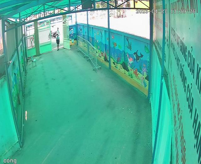 An indoor skating rink with a mural on the wall