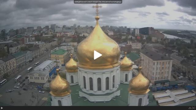 An aerial view of a church with gold domes