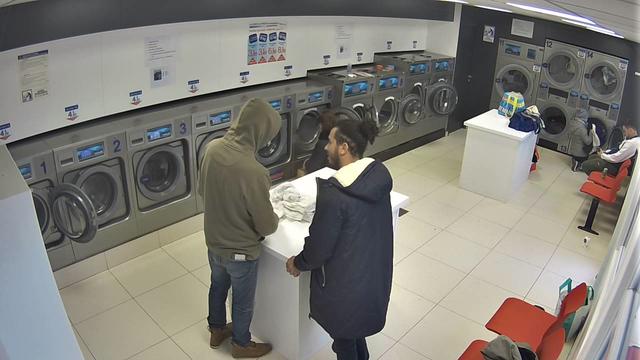 A man standing in front of a washing machine