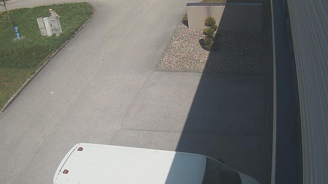 An aerial view of a parking lot with a truck parked in front of it