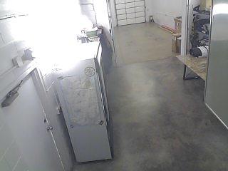 A refrigerator and a freezer in a room